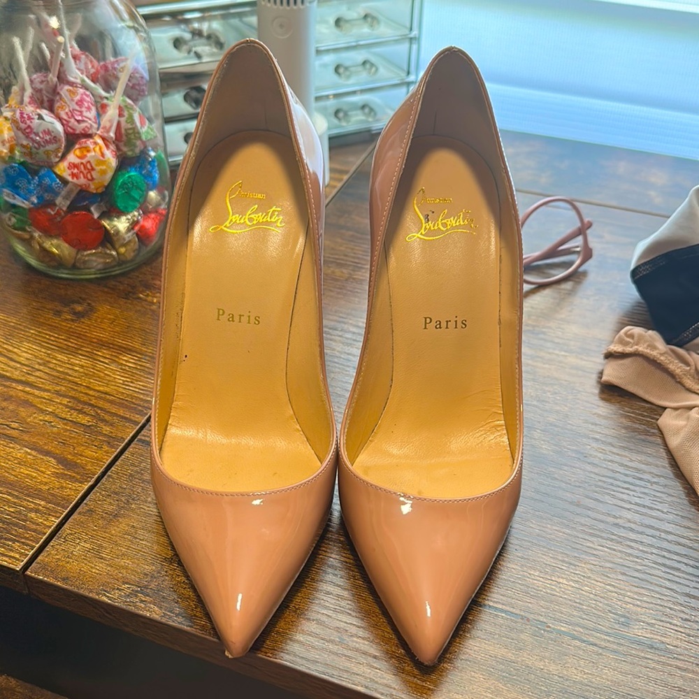 Nude color Louboutin shoes